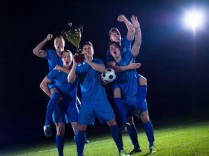 soccer players celebrating victory